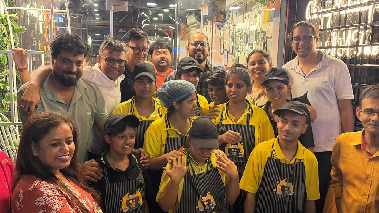 The Opportunity Cafe crew photographed together during the celebration