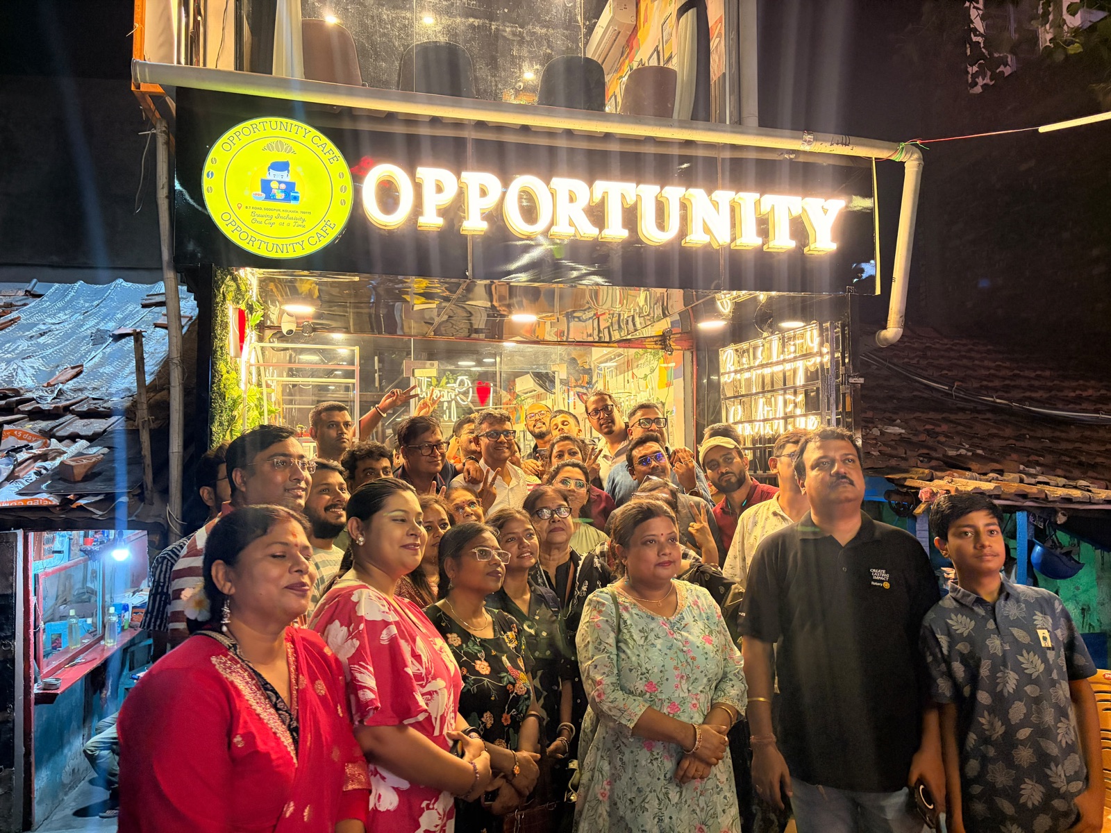 Supporters gathered outside the Opportunity Cafe storefront in Sodepur